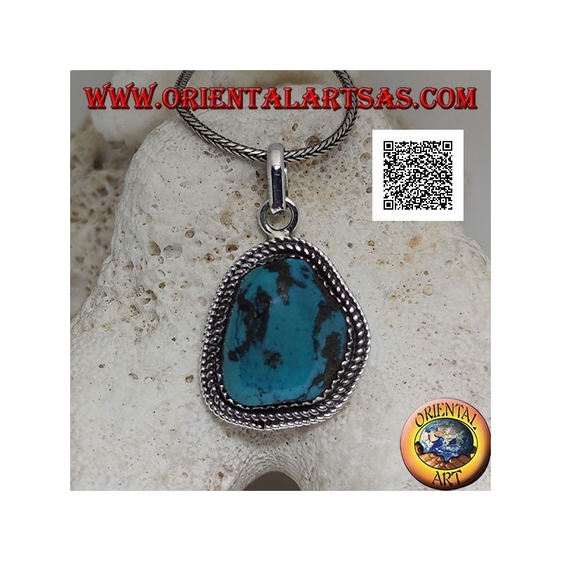 Silver pendant with ancient Tibetan turquoise of irregular shape surrounded by weaving
