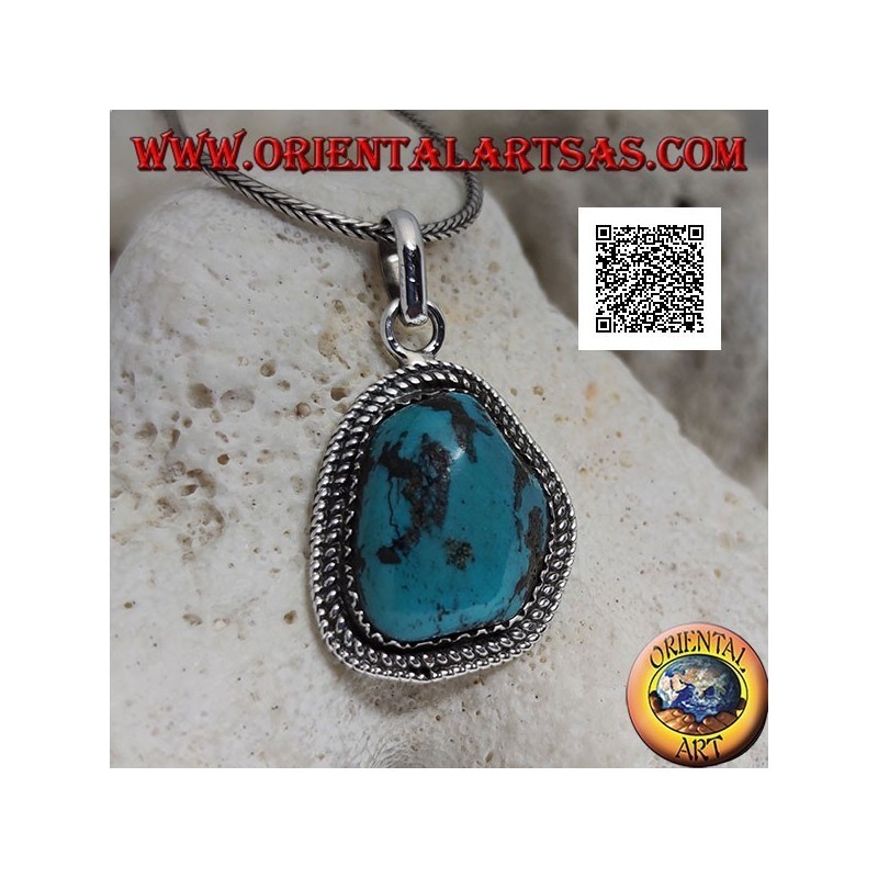 Silver pendant with ancient Tibetan turquoise of irregular shape surrounded by weaving