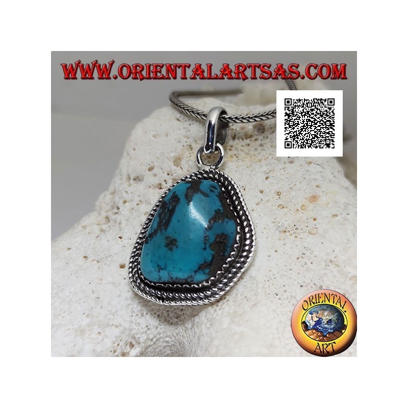 Silver pendant with ancient Tibetan turquoise of irregular shape surrounded by weaving