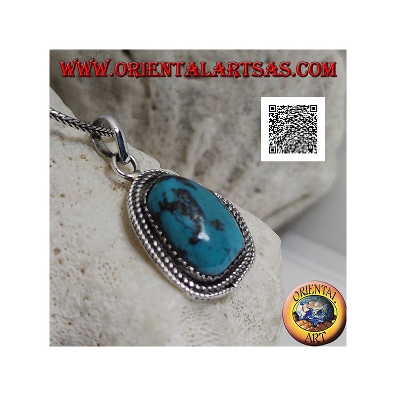 Silver pendant with ancient Tibetan turquoise of irregular shape surrounded by weaving