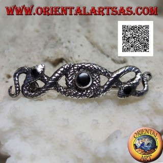 Broche en argent en forme de deux serpents entrelacés d'onyx central et sur les yeux