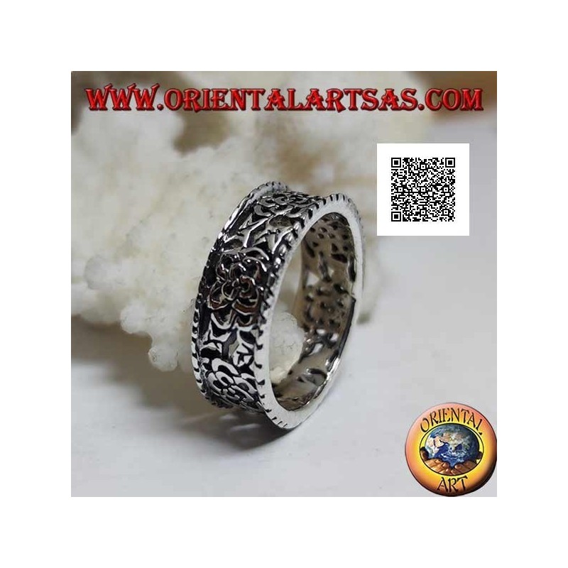 Silver ring with a dense openwork floral pattern and protruding edges