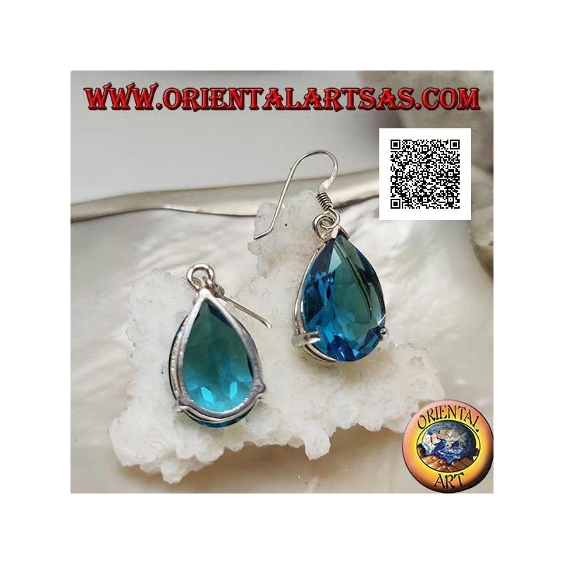 Aretes colgantes de plata con topacio azul grande engastados en un entorno sencillo