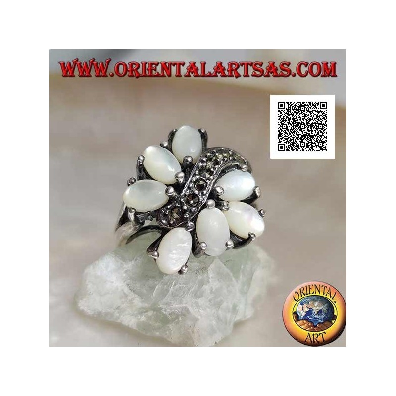 Silver ring with seven oval mother-of-pearl set separated by a curved line of marcasite
