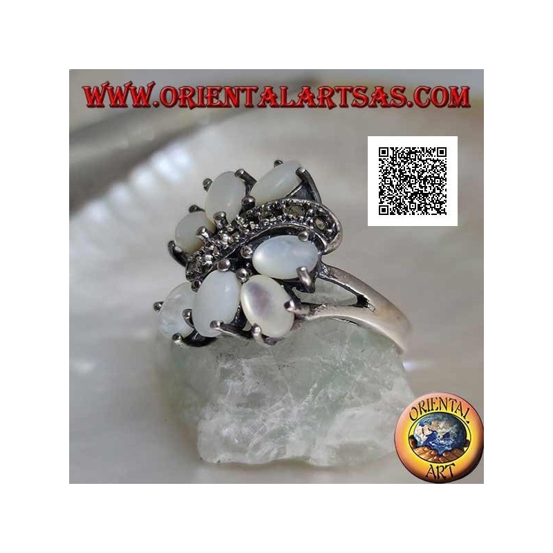 Silver ring with seven oval mother-of-pearl set separated by a curved line of marcasite