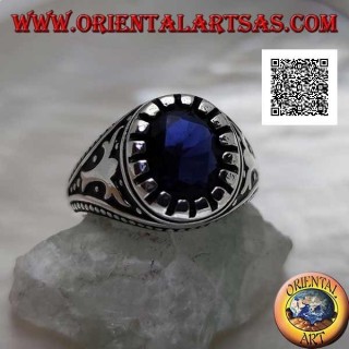 Silver ring with faceted oval synthetic sapphire with imperial motif engraved on the sides