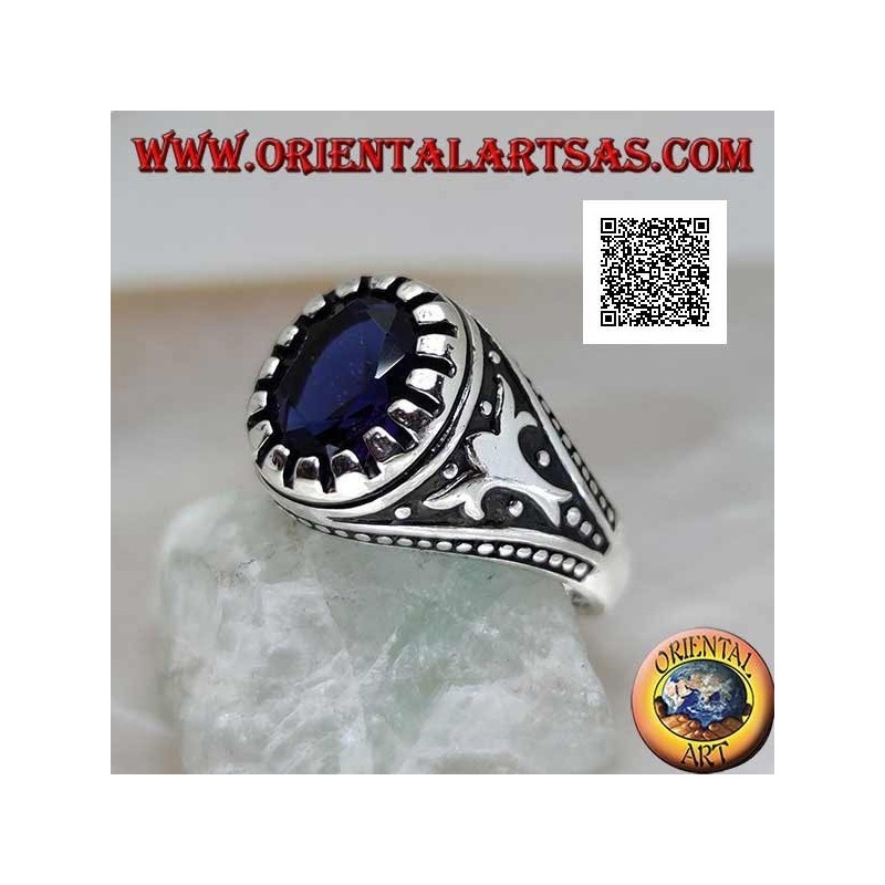 Silver ring with faceted oval synthetic sapphire with imperial motif engraved on the sides