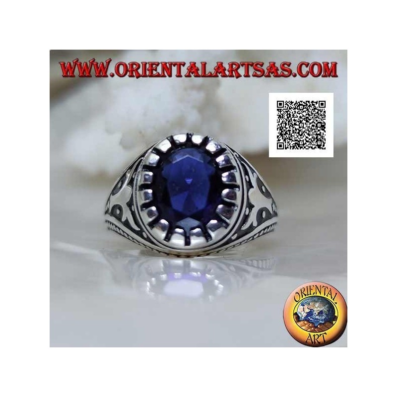 Silver ring with faceted oval synthetic sapphire with imperial motif engraved on the sides