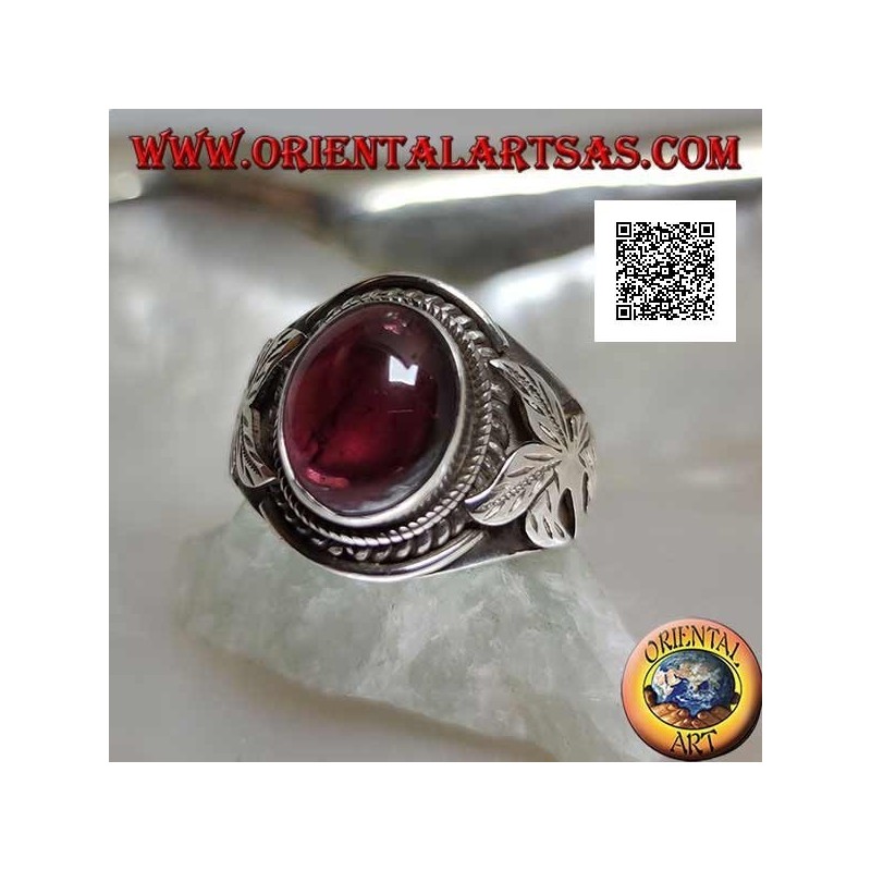 Silver ring with oval cabochon natural garnet and flower on the sides