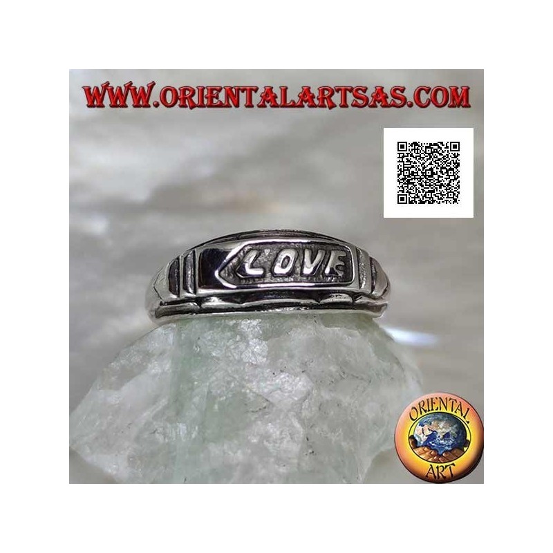 Silver ring with "LOVE" writing in bas-relief on a plate