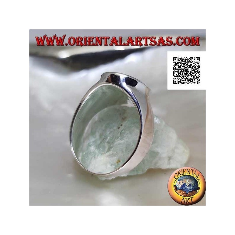 Silver ring with oval onyx flush with slightly raised edge on smooth frame