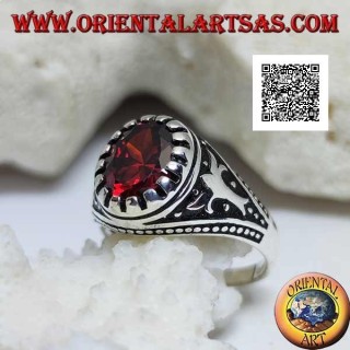 Silver ring with faceted oval garnet with imperial motif engraved on the sides