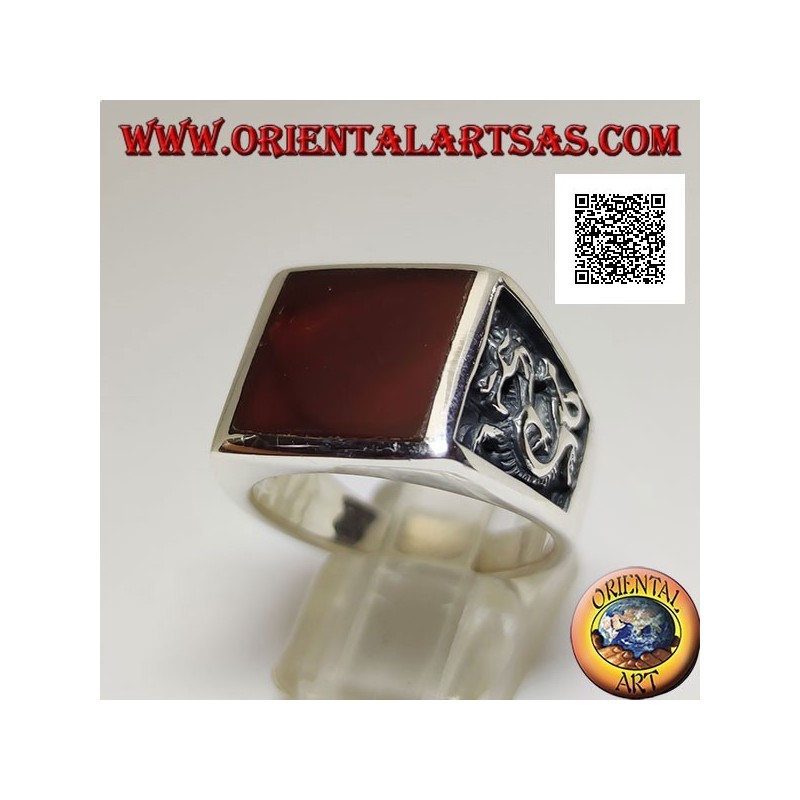 Silver ring with square carnelian and profile dragon in bas-relief on the sides