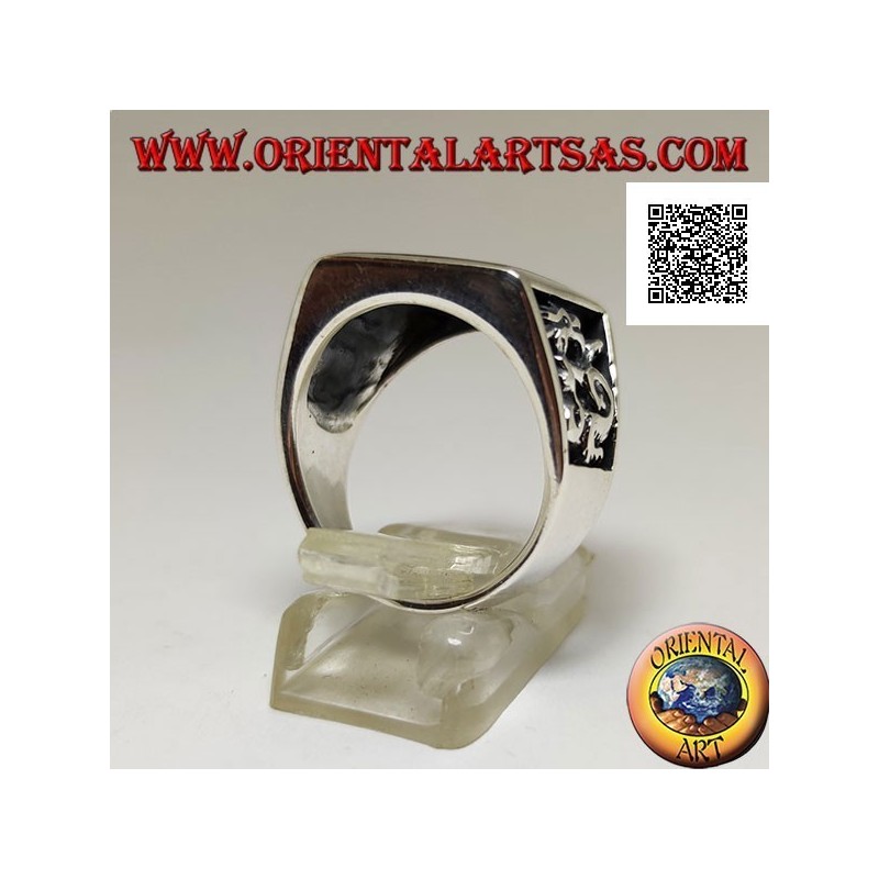 Silver ring with square carnelian and profile dragon in bas-relief on the sides
