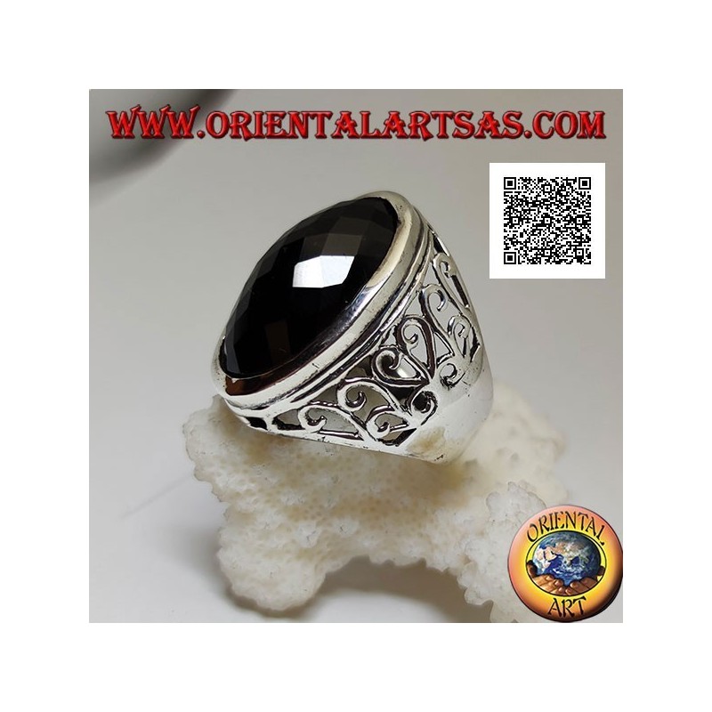 Silver ring with large oval faceted onyx and wavy openwork decoration on the sides
