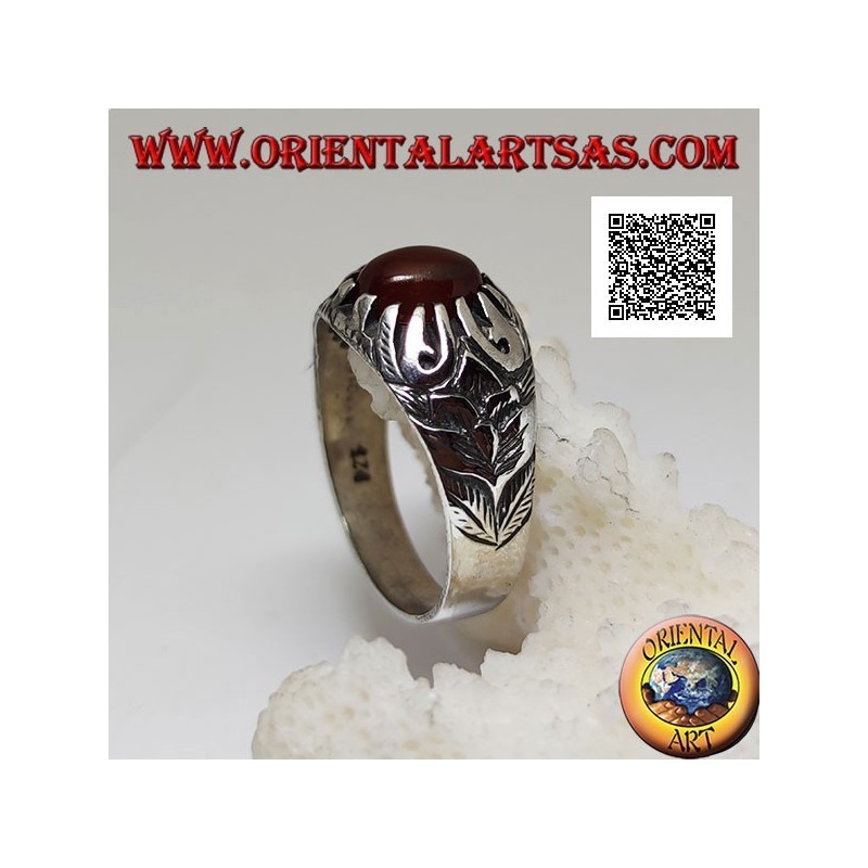 Silver ring with cabochon oval carnelian set with claws and floral decorations in relief on the sides