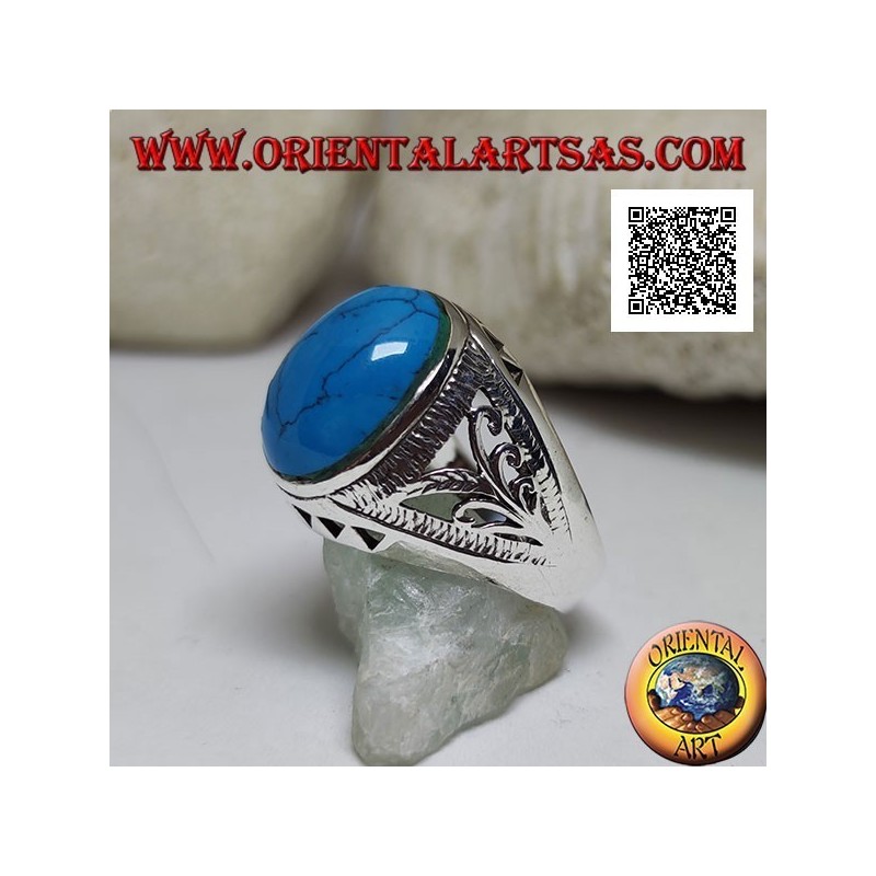 Silver ring with oval cabochon turquoise and floral and triangular decoration on the sides