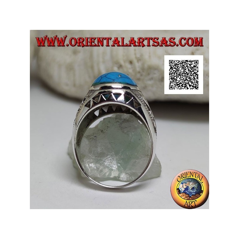 Silver ring with oval cabochon turquoise and floral and triangular decoration on the sides