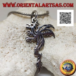 Silver pendant in the shape of a wyvern (two-legged winged dragon) in a tribal style profile
