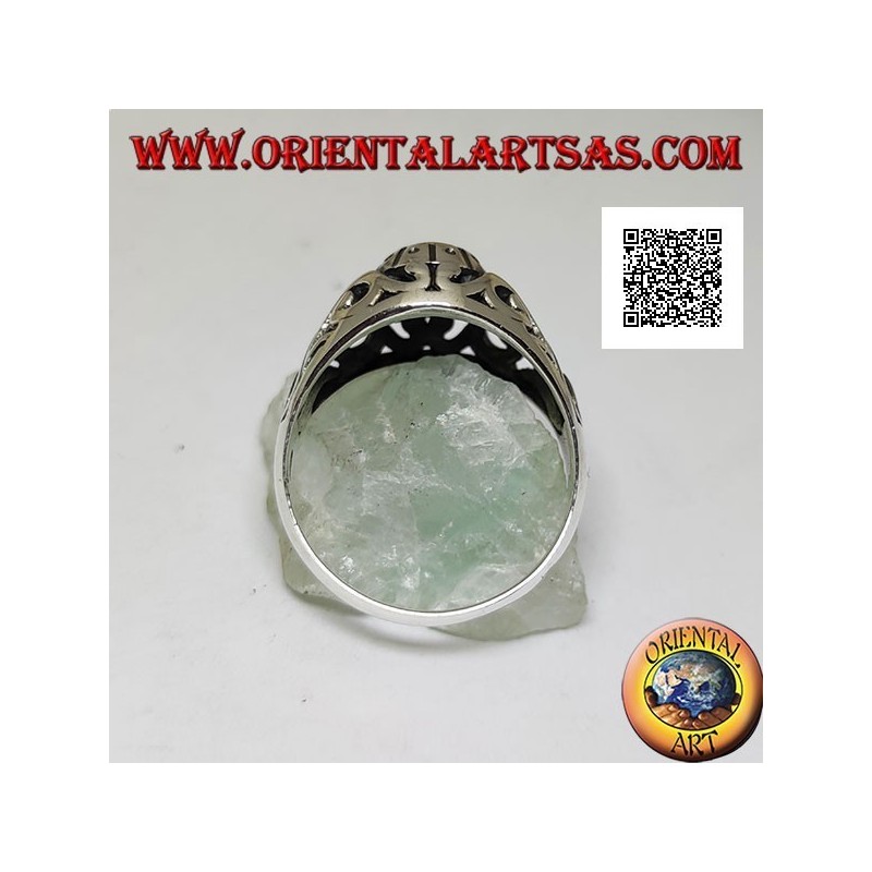 Silver ring with faceted oval onyx and openwork floral decoration on the sides