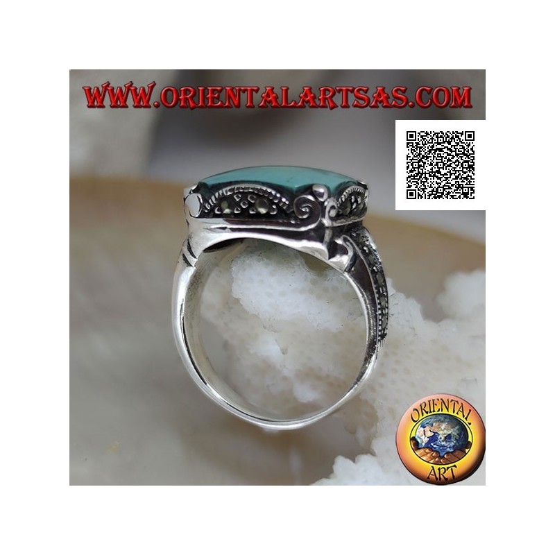 Silver ring with square cabochon turquoise in wavy frame and marcasite around and on the sides