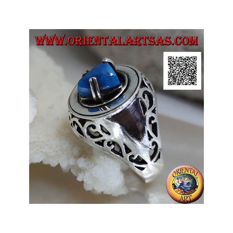 Silver ring with turquoise pyramid set on a smooth disc with floral openwork on the sides