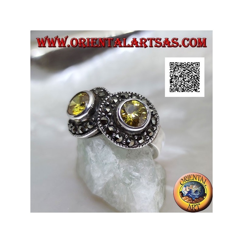 Bague en argent avec deux topazes rondes jaunes en deux cercles parsemés de marcassite se croisant