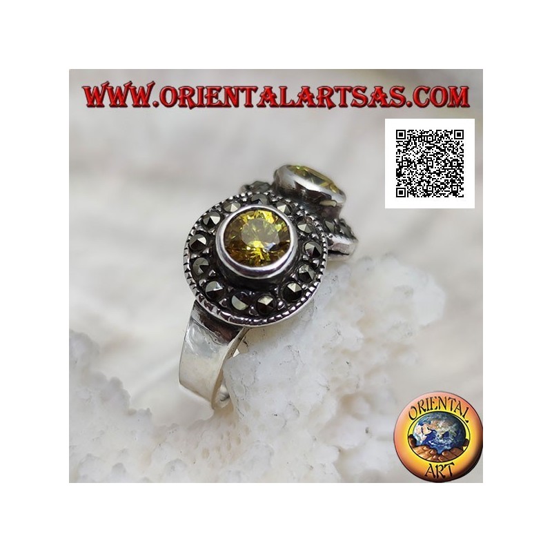 Silver ring with two round yellow topazes in two circles studded with marcasite intersecting each other