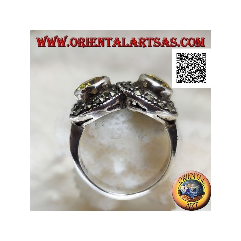 Bague en argent avec deux topazes rondes jaunes en deux cercles parsemés de marcassite se croisant