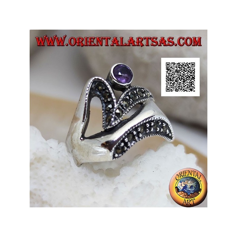Silver ring of abstract shape in futuristic style with parts of marcasite and round amethyst