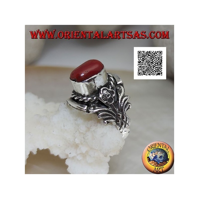 Silver ring with oval Tibetan antique coral with interweaving and integral flower on the sides
