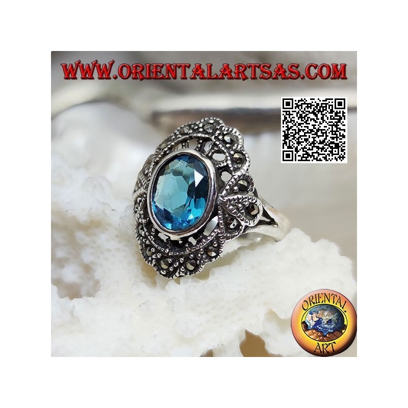 Anillo nube de plata con topacio azul ovalado y marcasita