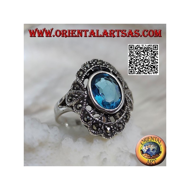 Anillo nube de plata con topacio azul ovalado y marcasita