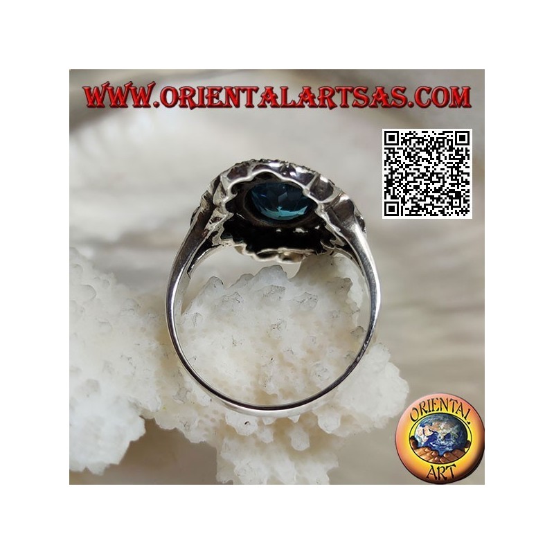 Anillo nube de plata con topacio azul ovalado y marcasita