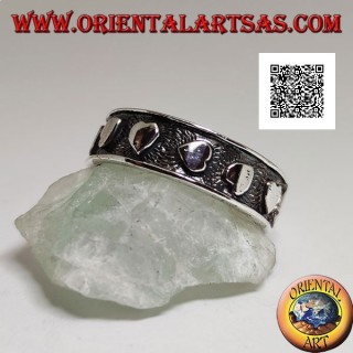 Silver ring with smooth hearts in randomly oriented bas-relief