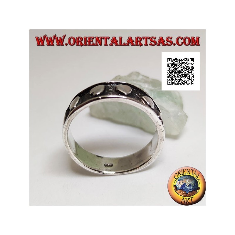 Silver ring with smooth hearts in randomly oriented bas-relief