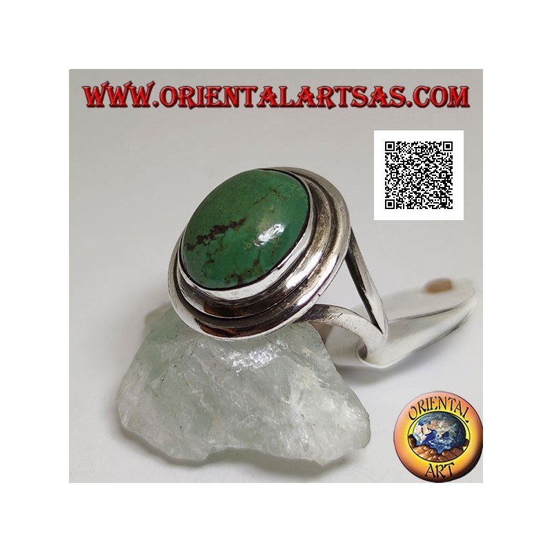 Silver ring with antique oval Tibetan turquoise with double smooth edge laterally hooked to two