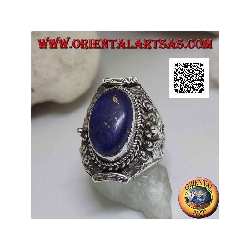 Silver ring with oval lapis lazuli on Nepalese setting and ethnic floral decoration in high relief