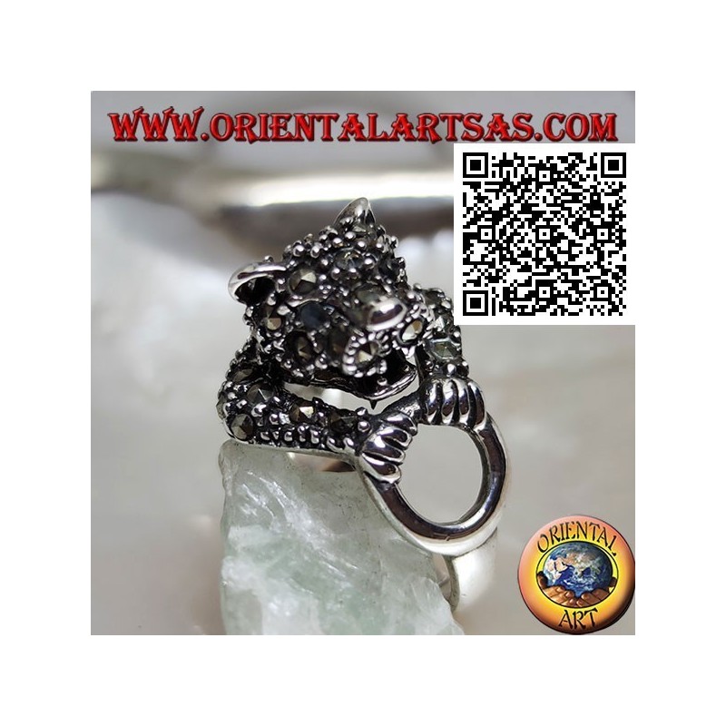 Half-length tiger silver ring studded with marcasite grabbing a ring