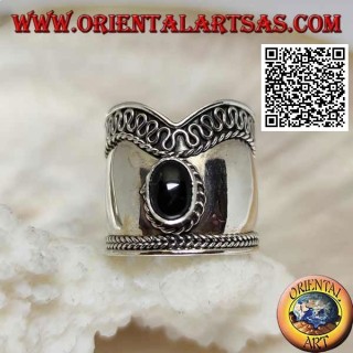 Silver ring with wide V-shaped band with oval onyx and serpentine on one side, Bali