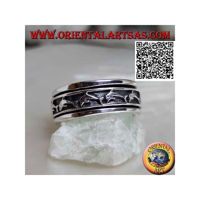 Anti-stress rotating silver ring, with a series of jumping dolphins in bas-relief