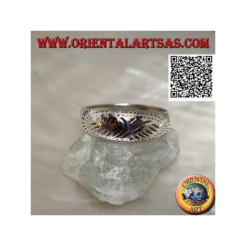 Silver ring with a lightly carved oriental design
