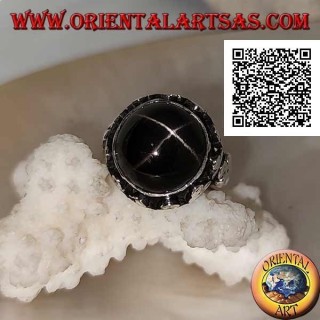 Silver ring with a round cabochon-shaped Black Star on a high-edged frame with trio of discs