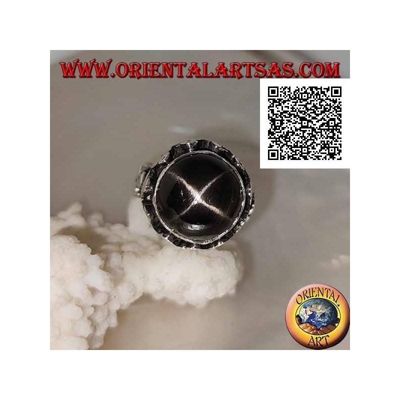 Silver ring with a round cabochon-shaped Black Star on a high-edged frame with trio of discs