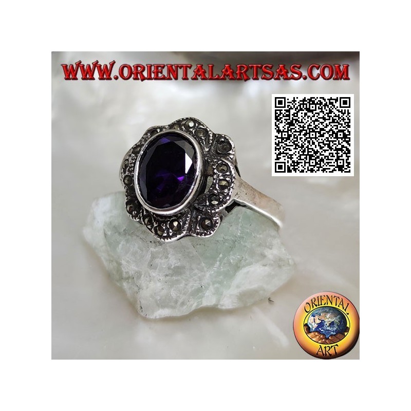 Silver ring with oval amethyst-colored zircon surrounded by wavy bands of marcasite