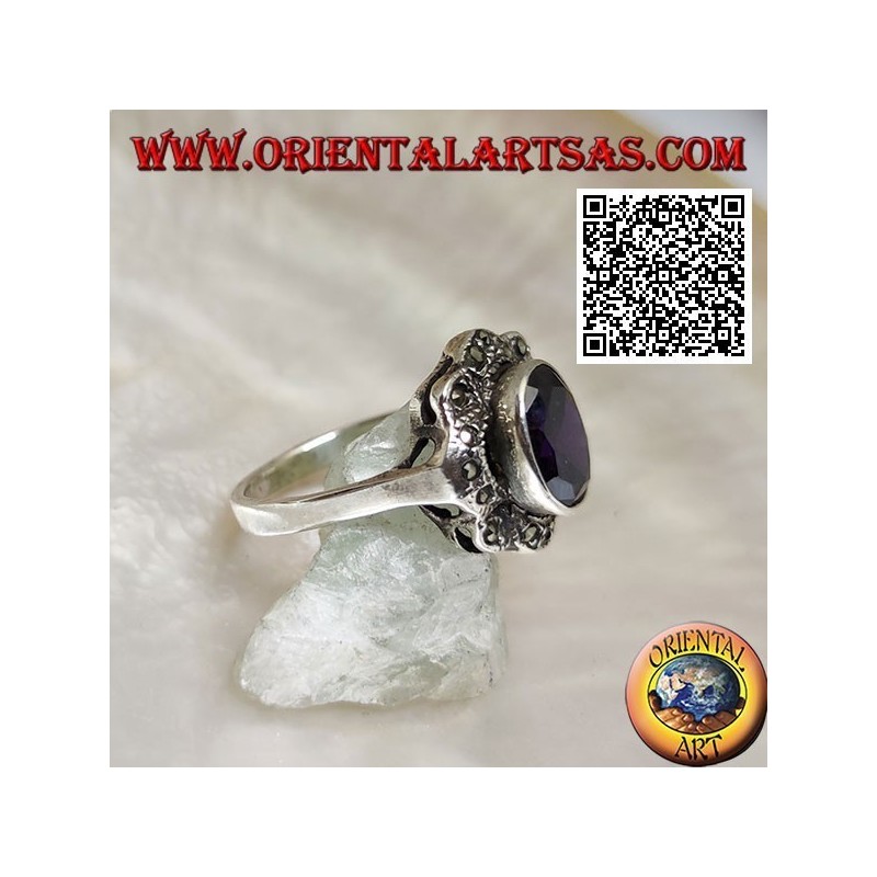 Silver ring with oval amethyst-colored zircon surrounded by wavy bands of marcasite