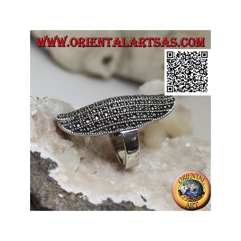 Silver ring in a large elliptical shape with a rounded center studded with marcasite