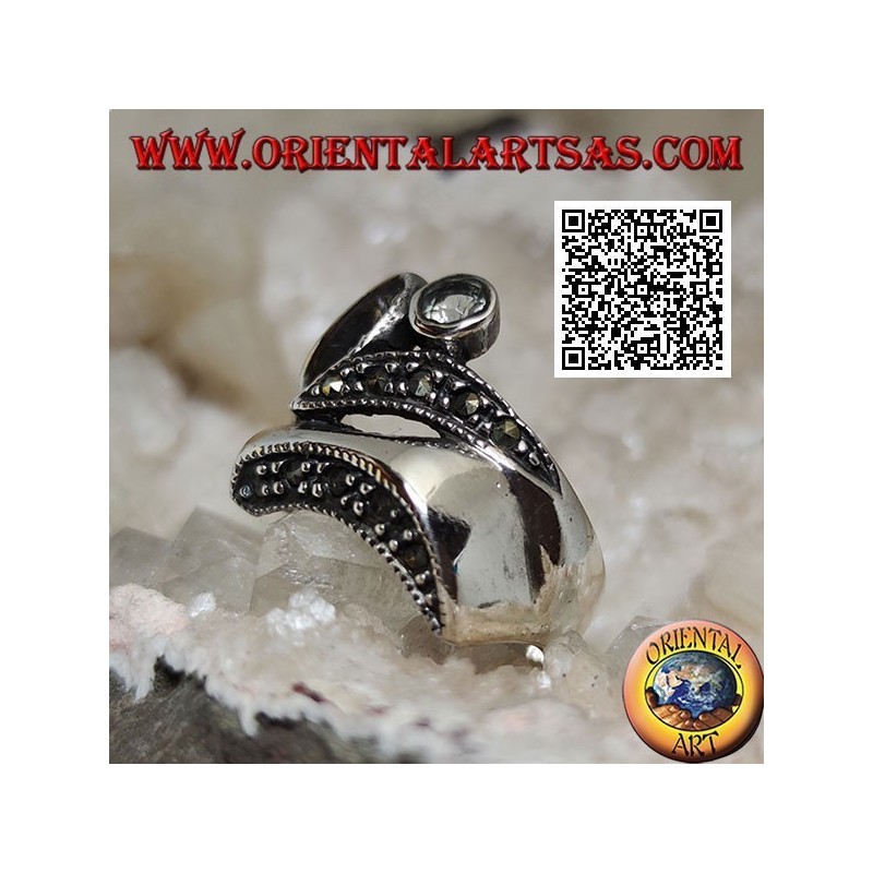 Silver ring of abstract shape in futuristic style with parts of marcasite and round aquamarine