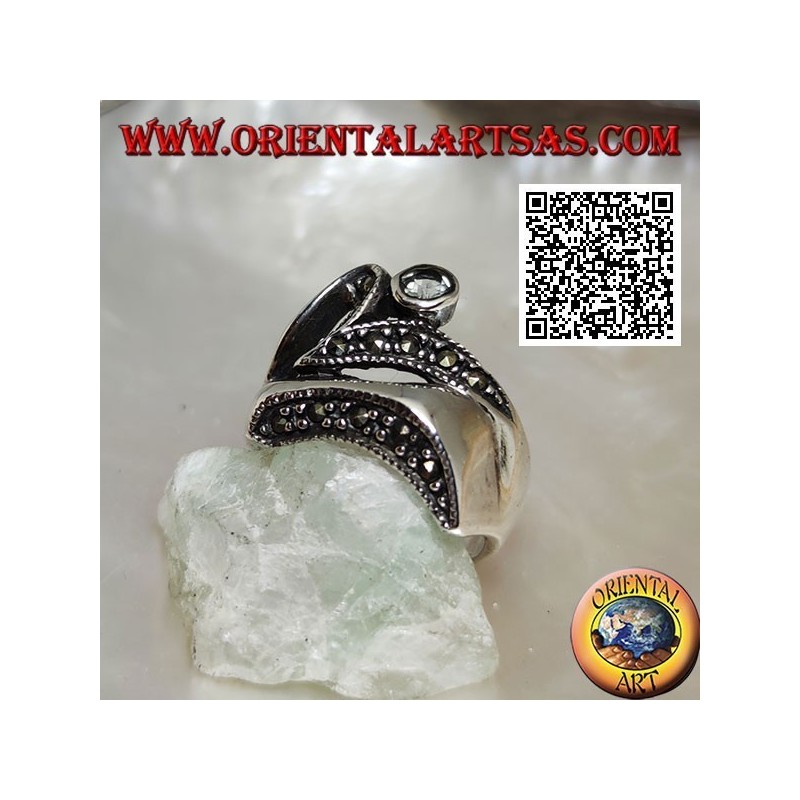 Silver ring of abstract shape in futuristic style with parts of marcasite and round aquamarine