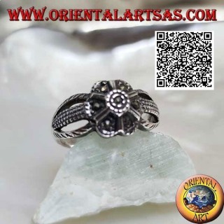 Silver ring in the shape of a flower with six petals attached to three threads studded with marcasite